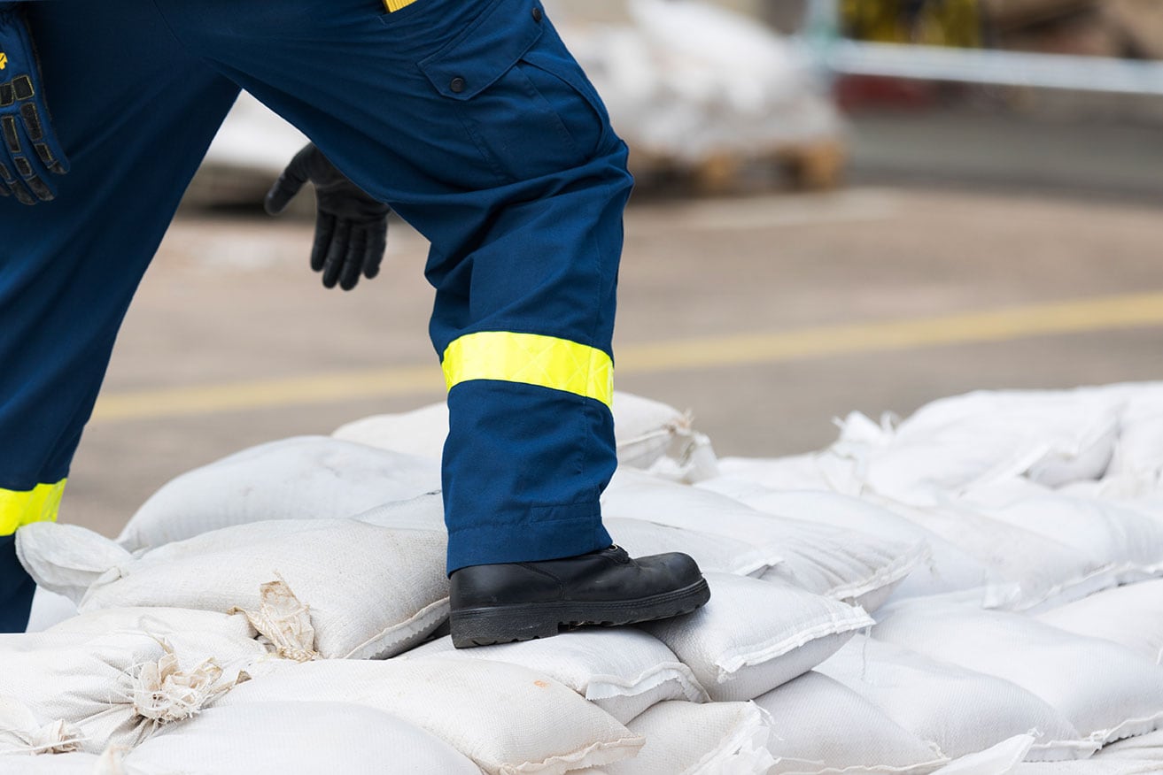 Person standing on sandbags Person standing on sandbags
